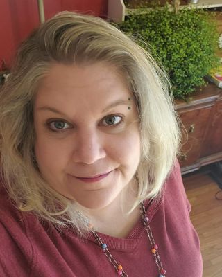Nancy K Miller